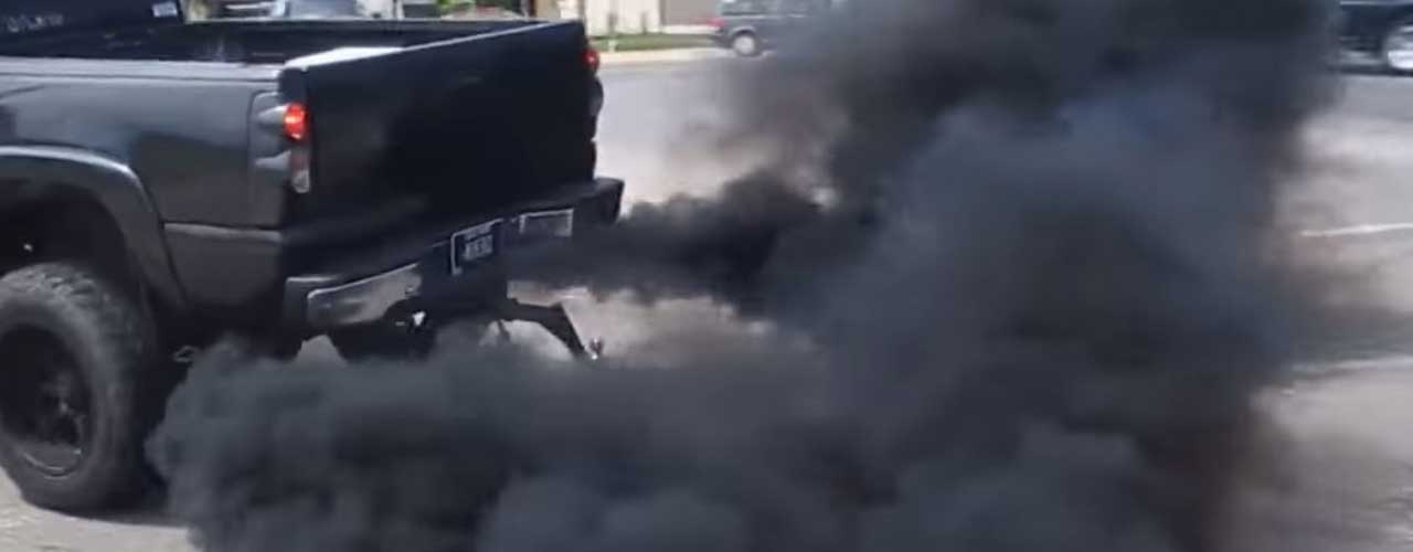 Black Diesel Ute blowing black smoke out of the exhaust