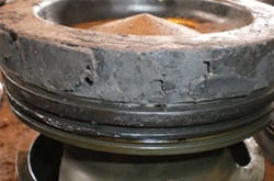 Caterpillar piston without FTC Decarbonizer — heavy carbon on the top land