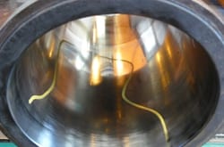 Cylinder bore with cross hatching worn away by piston deposits