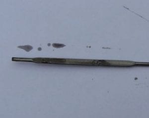 Clean oil showing on a dipstick after flushing the engine with Flushing Oil Concentrate