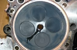 MTU cylinder head treated with FTC Decarbonizer — soft carbon wipes off