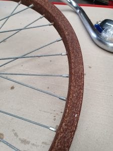 heavily rusted bicycle rim 